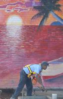 Looking as if he is doing some beach work, Mickey Fernanders with the City of Spartanburg's concrete and asphalt crew, works next to a mural of the beach, making the curb handicap accessible at Union Street and East Park Ave. in Spartanburg S.C. Tuesday, May 2, 2006.  According to Fernanders the city is doing the work on all the sidewalks in the city.(AP Photo/Spartanburg Herald Journal,Gerry Pate)