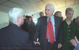 John McCain shakes hands with fellow POW Tom Pyle upon his arrival at VFW Post # 9539 in Spartanburg S.C. early Thursday morning. 7/17/00