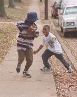 Andre chases his sisiter Ashley Gentry down the sidewalk Ashley outside their South Spartanburg home.