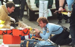 Recue workers fight to save Deion Gentry as his sister Ashley is carried to an ambulance.  Photo 2-4-93